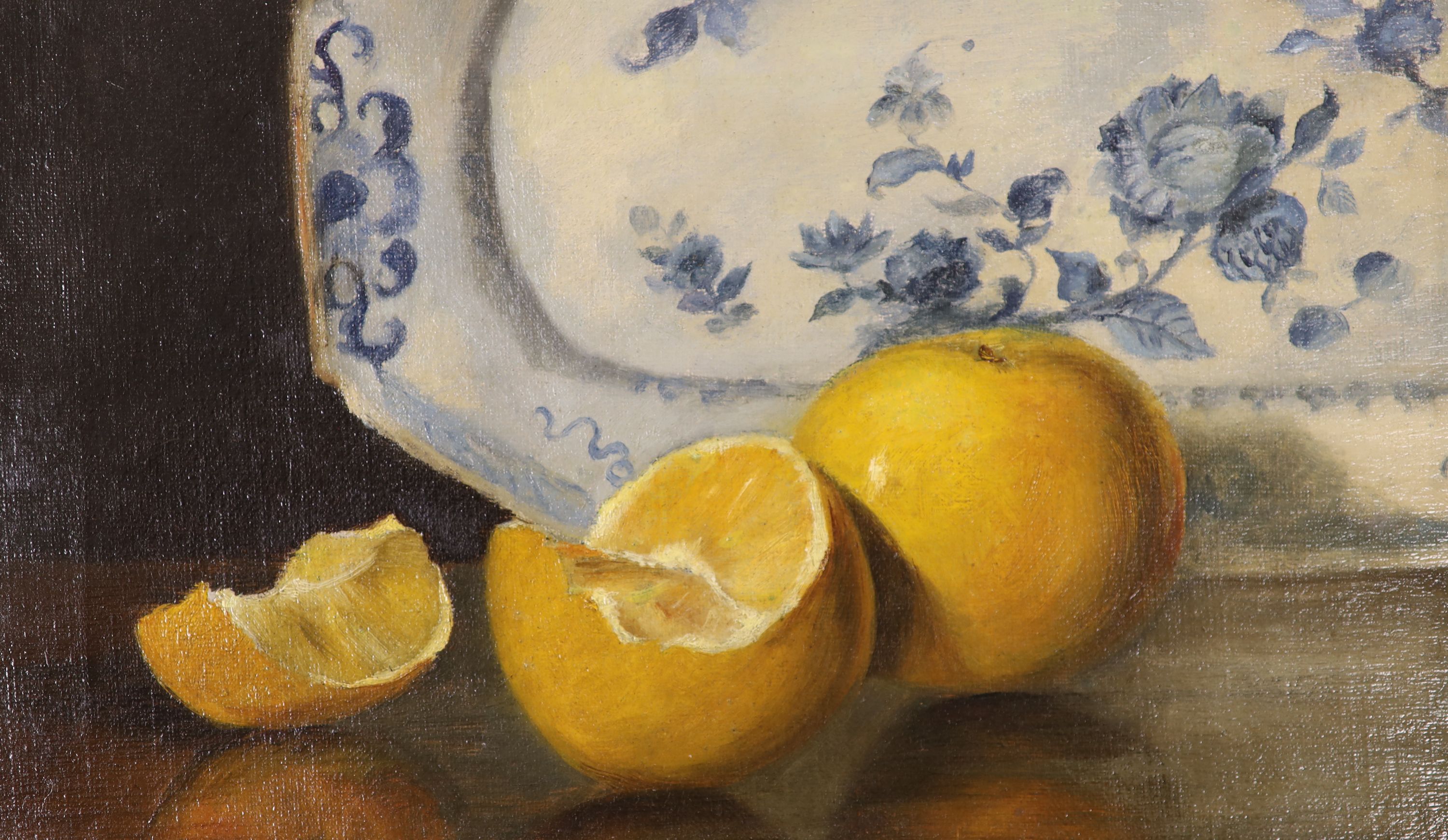 English School c.1900, oil on canvas, Still life of oranges and a delft plate, 17 x 29cm